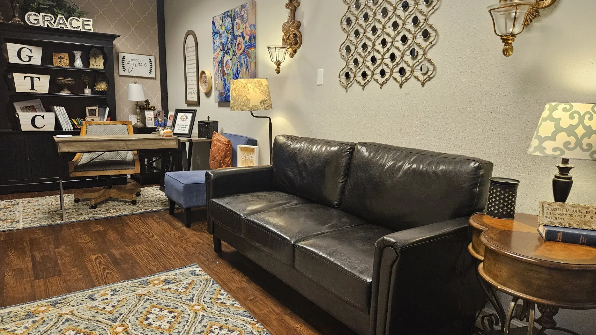 The adult wing lobby, with a sofa, desk and GTC shelves